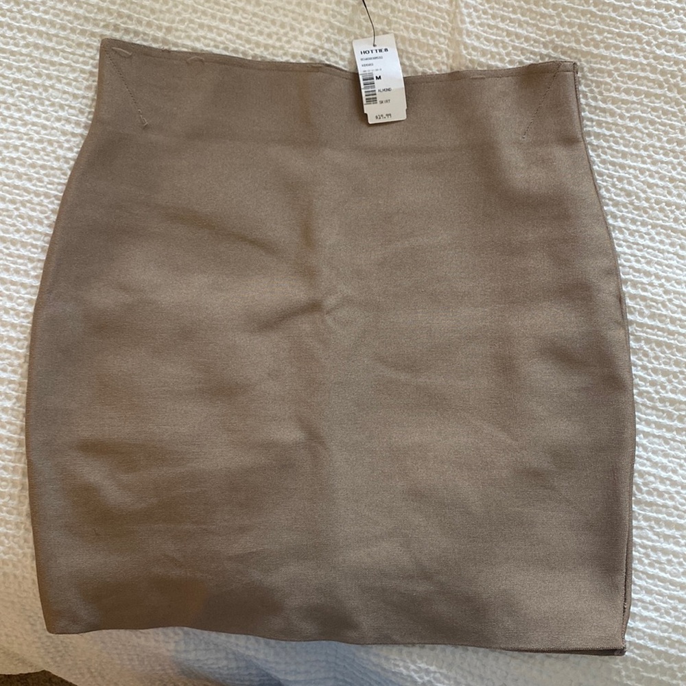 Very tight, NWT pencil skirt. Color “almond”.